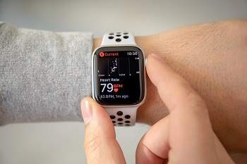 Person checking iPhone watch