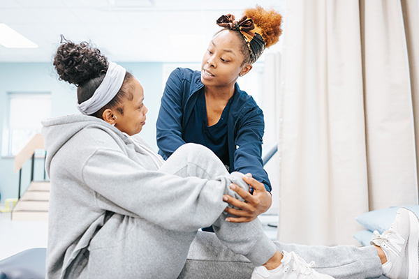 A patient getting knee therapy