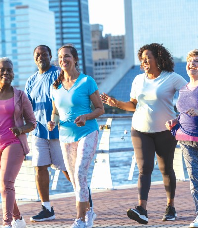 A group of women on a shoreline boardwalk